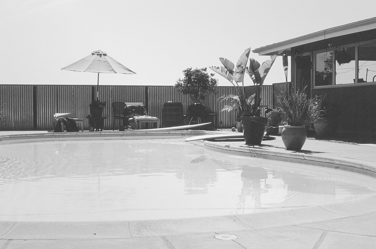 Gunite pool shell under construction in a Cape Coral backyard